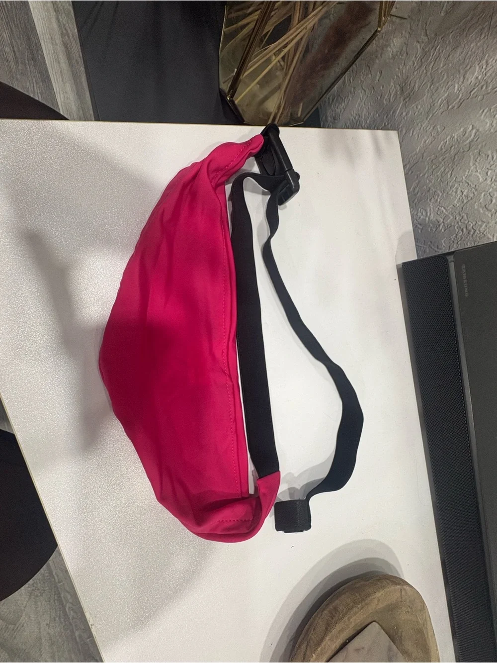 Nike pink waist pack with white Swoosh and black strap